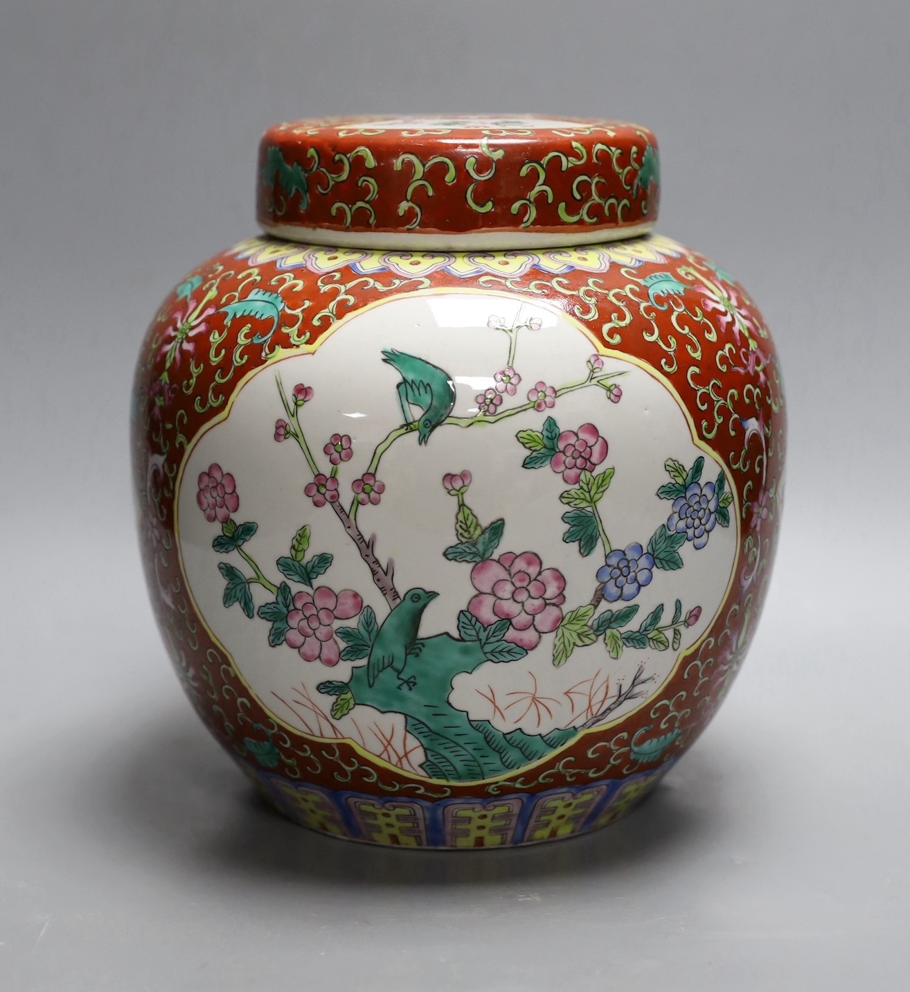 A Chinese coral ground jar and cover, 23cm